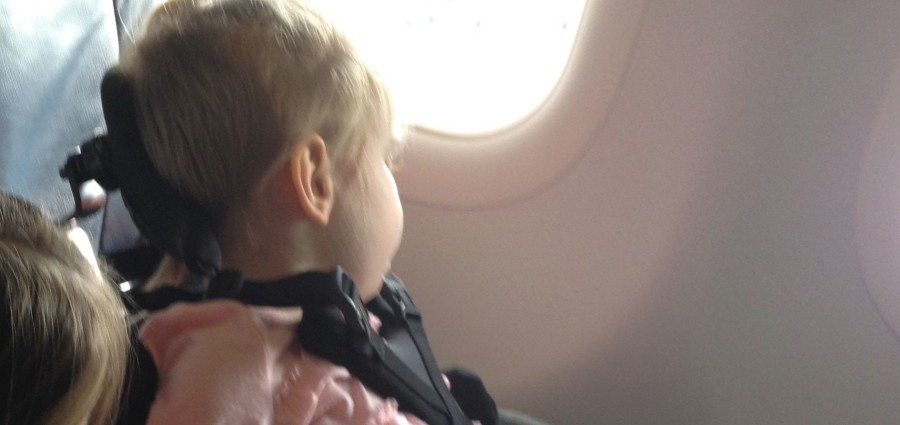 Harper looking out the window of the airplane