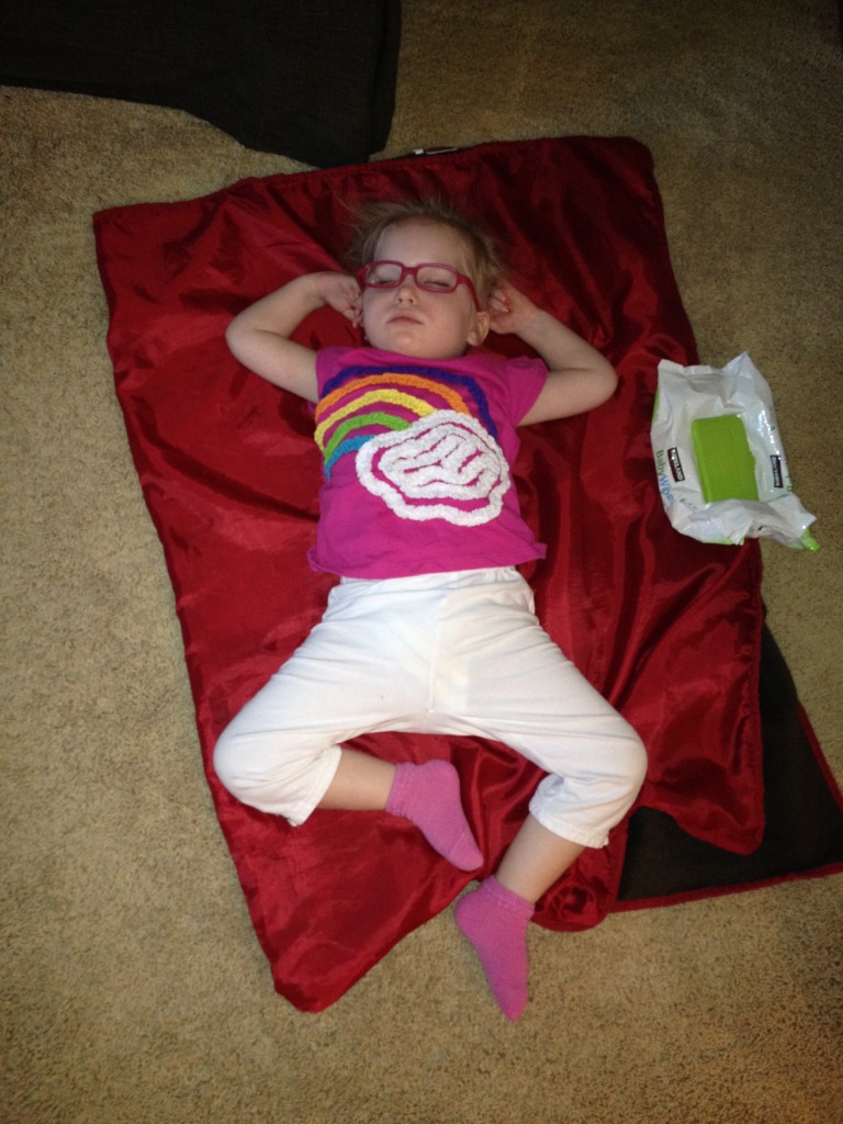 Harper sleeping on a floor blanket