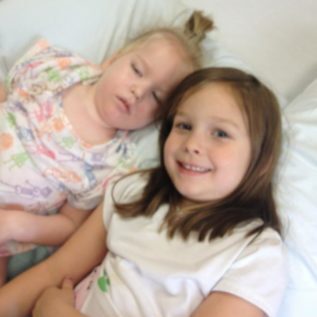 Lily visits little sister Harper in the hospital